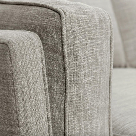 Rain Cloud Gray MCM loveseat by Article with honey oak legs, showcasing mid-century modern style and plush upholstery.
