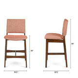 Orange upholstered Article MCM-style barstool with walnut wooden legs, modern design, and comfortable seat.
