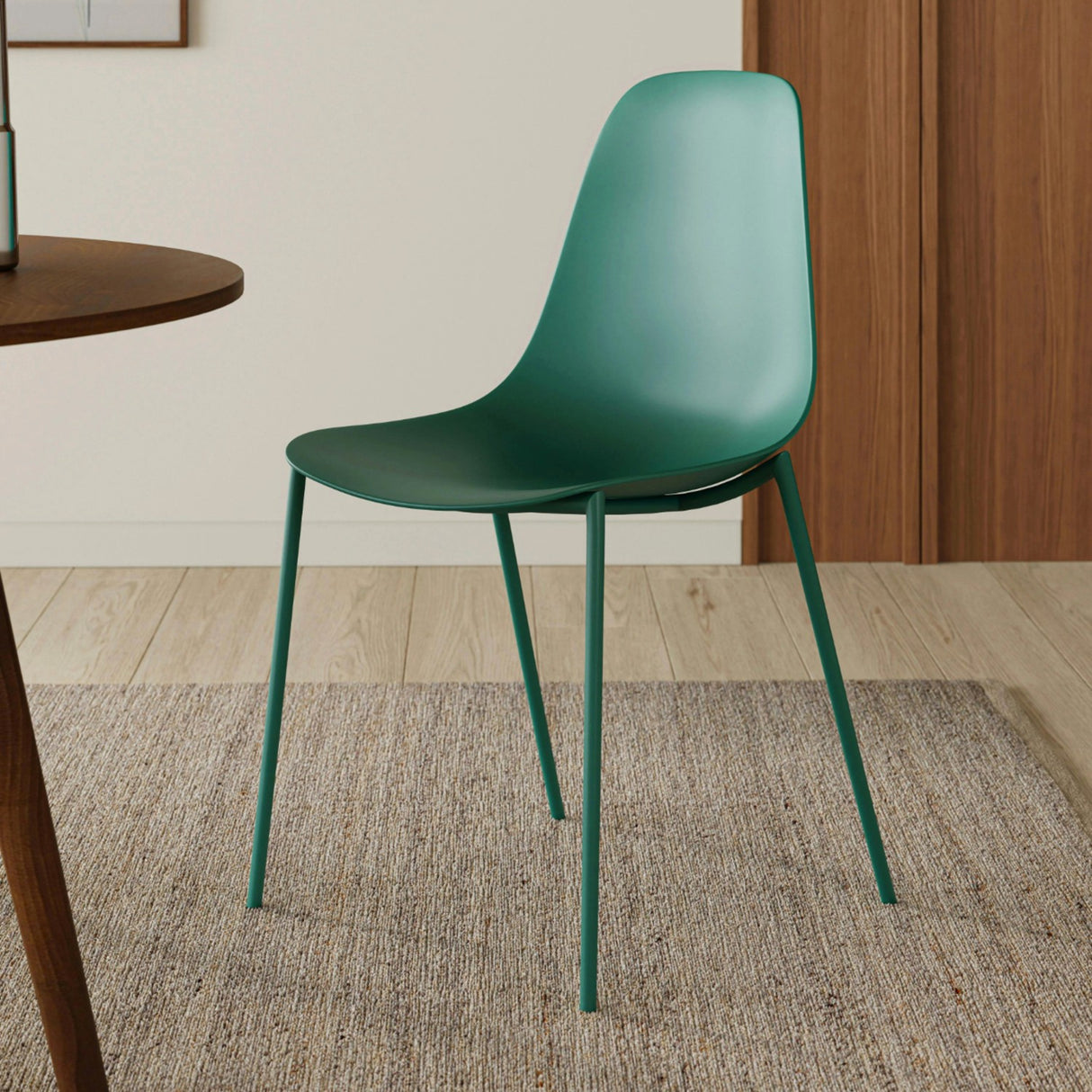 Woodland green Article MCM-style dining chair with wooden legs and curved backrest, modern and stylish for dining room decor.