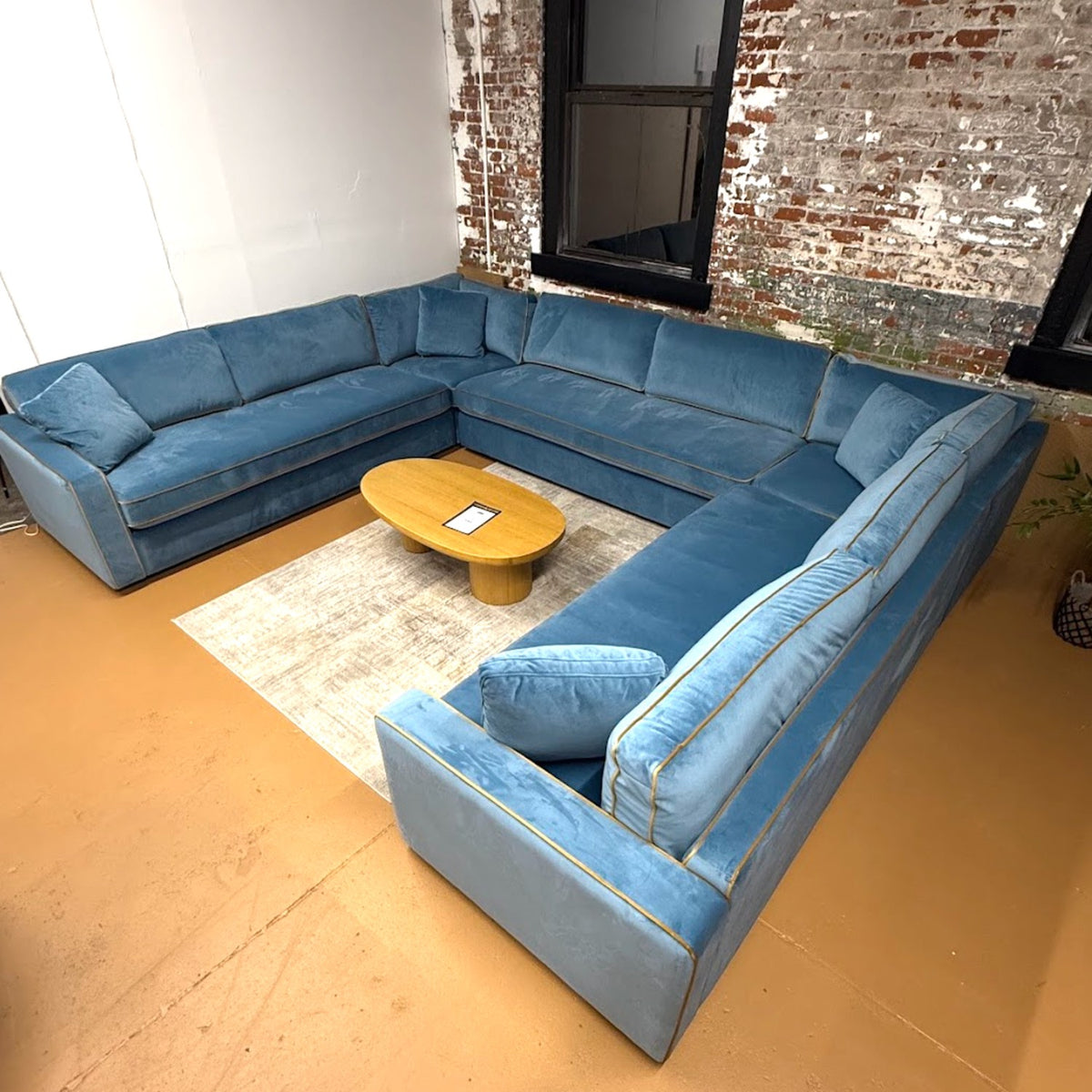 Blue velvet James 5-piece sectional sofa by Interior Define, showing plush cushions and modern design in a living room setting.
