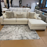 Pull Up A Couch Briarwood 2-piece sectional sofa with plush cushions and modern design, shown in a stylish living room setup.