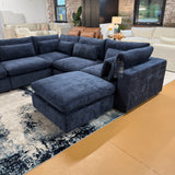 Pull Up A Couch Serenity Cloud blue 5-piece sectional with storage ottoman, featuring plush cushions and modern design.