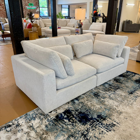 Pull Up A Couch Serenity Cloud 2-piece sectional sofa with plush fabric and modern design, featuring multiple cushions and a spacious seating area.