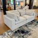 Pull Up A Couch Serenity Cloud 2-piece sectional sofa with plush fabric and modern design, featuring multiple cushions and a spacious seating area.