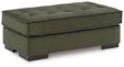 Oversized Caspian-Town accent ottoman by Signature Design Ashley, showing a plush fabric surface and sturdy wooden legs.