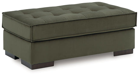 Oversized Caspian-Town accent ottoman by Signature Design Ashley, showing a plush fabric surface and sturdy wooden legs.