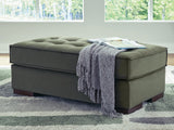 Caspian-Town oversized accent ottoman by Signature Design by Ashley with a plush fabric cover and sturdy wooden legs.