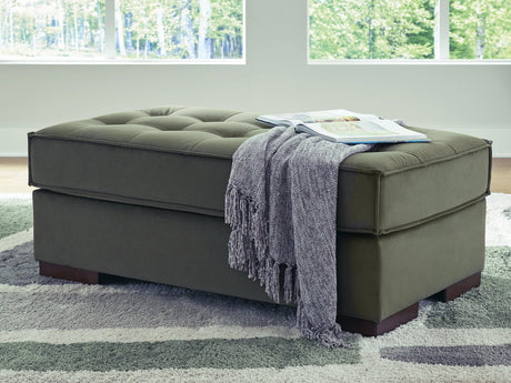Caspian-Town oversized accent ottoman by Signature Design by Ashley with a plush fabric cover and sturdy wooden legs.