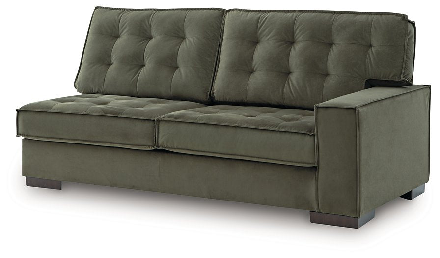 Angle view of Signature Design by Ashley Caspian-Town sectional with chaise, showcasing plush gray upholstery and modern design.