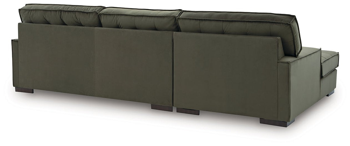 Signature Design Ashley Caspian-Town sectional with chaise, showing plush fabric and spacious seating in a modern living room setting.