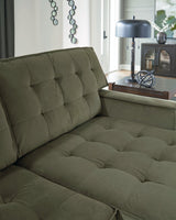 Close-up of the tufted detail on the beige Caspian-Town sectional with chaise by Signature Design by Ashley.